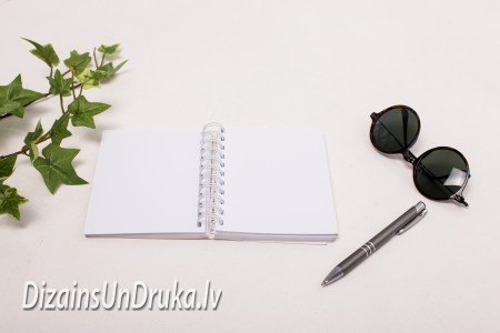 IMG_8305-1 Open spiral-bound notebook with pen and sunglasses, binding design