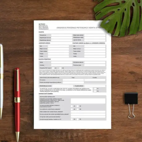 Printed form on a wooden desk with pens, sample for custom letterhead printing