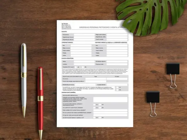 Printed form on a wooden desk with pens, sample for custom letterhead printing
