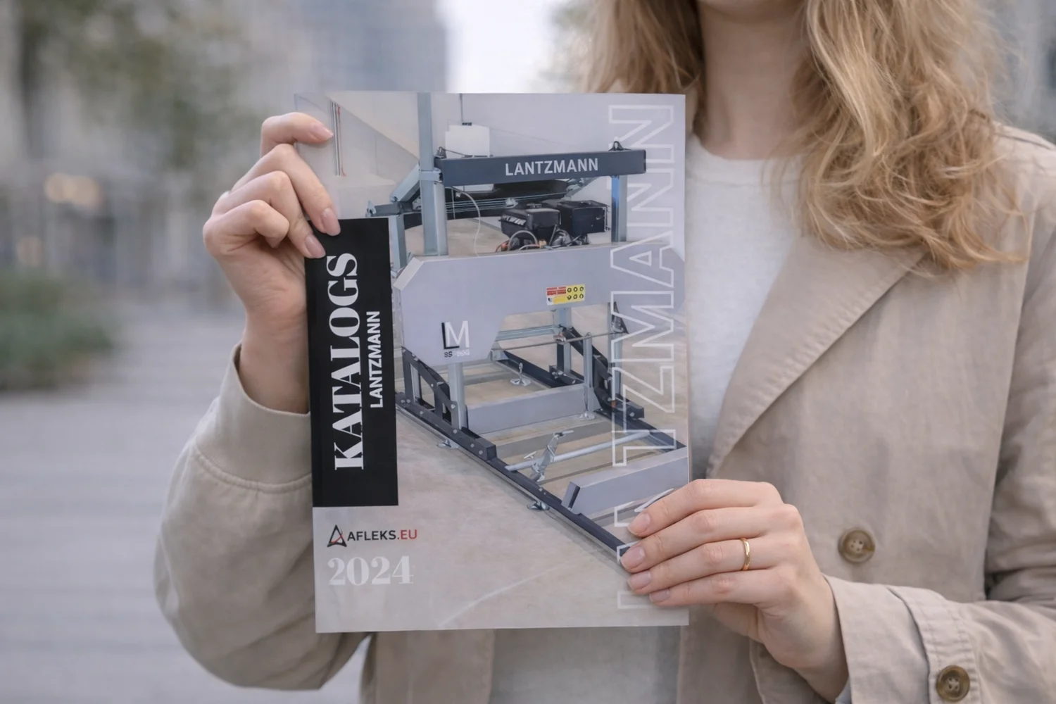 Woman holding a Lantzmann catalog showing custom brochure printing and professional print quality