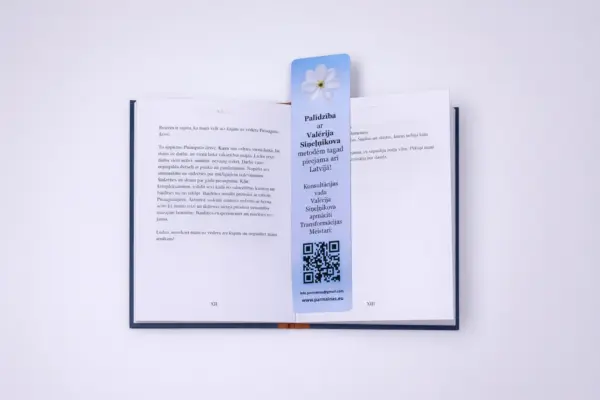 Custom bookmark printing sample with QR code placed in an open book