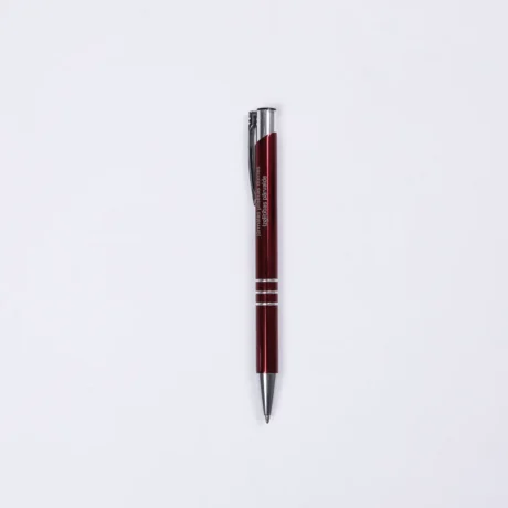 Red engraved metal pen BASIC on a white background