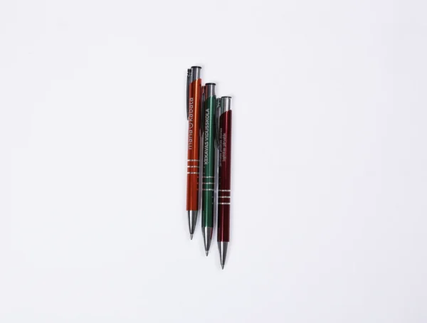 Three engraved metal pens BASIC on a white background