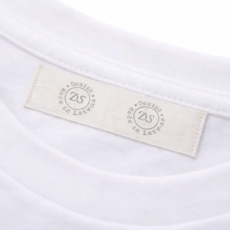 Custom cotton label printing sewn into the collar of a white T-shirt